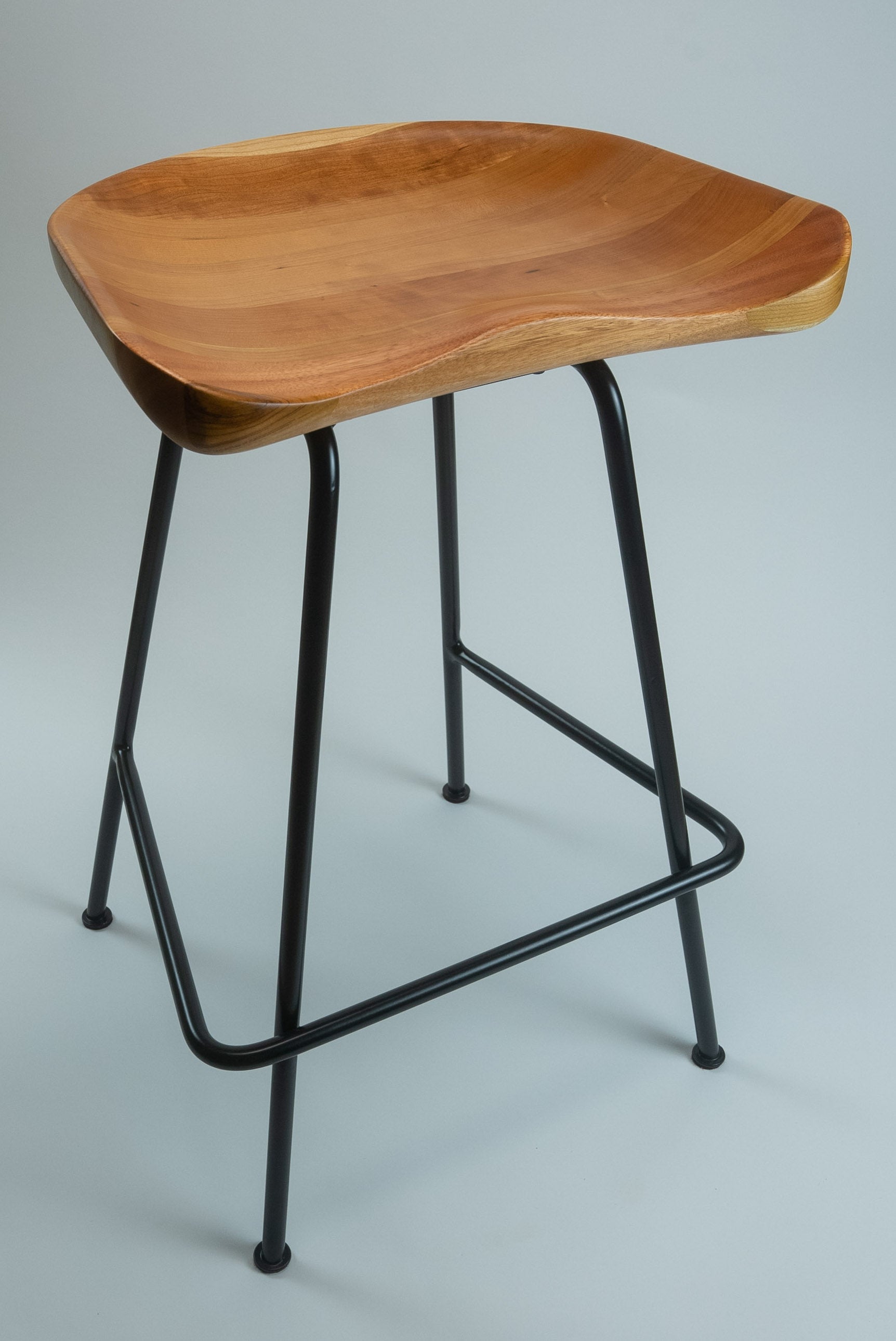 American Cherry Low Tide stool on black powder-coat base